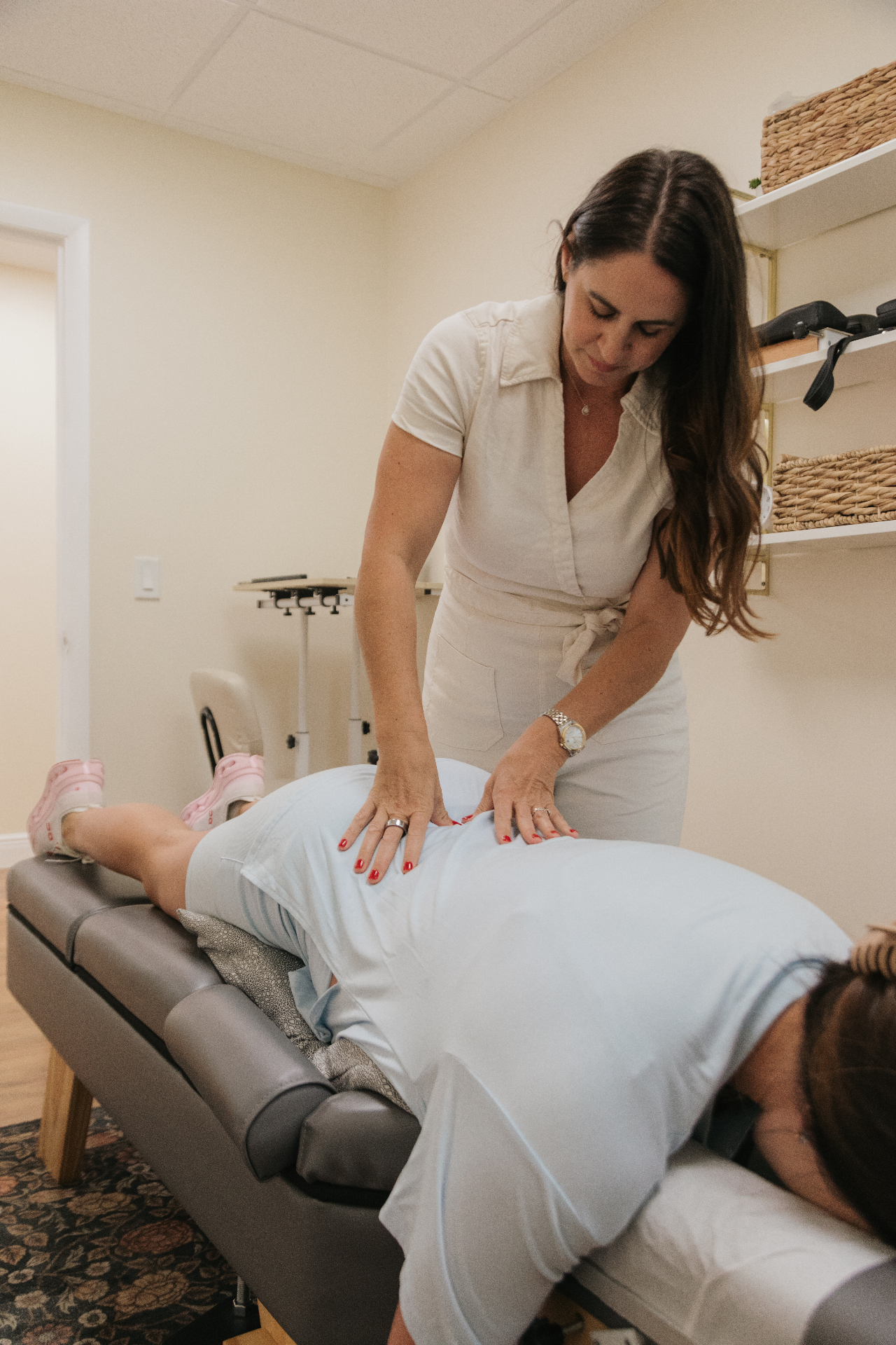 Prenatal chiropractic adjustment for a pregnant woman